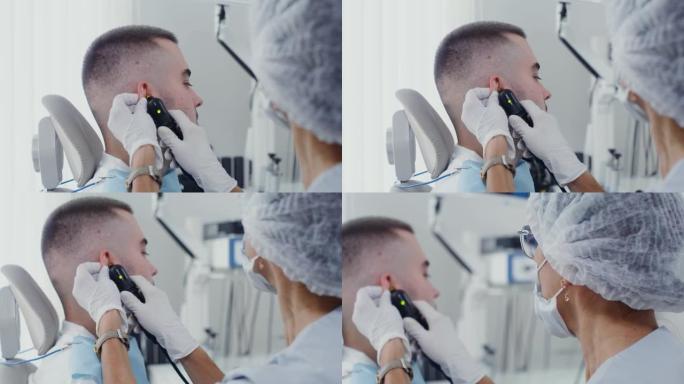 耳鼻喉科医生使用医学镜检查患者的耳廓