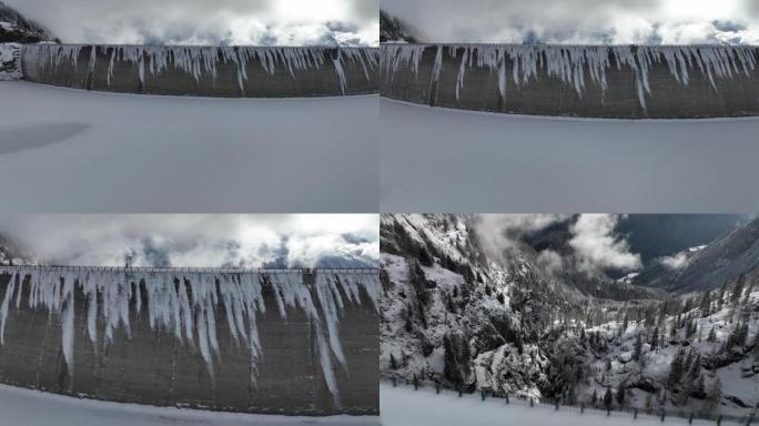 空中无人机拍摄的一名男子穿越山区积雪覆盖的大坝