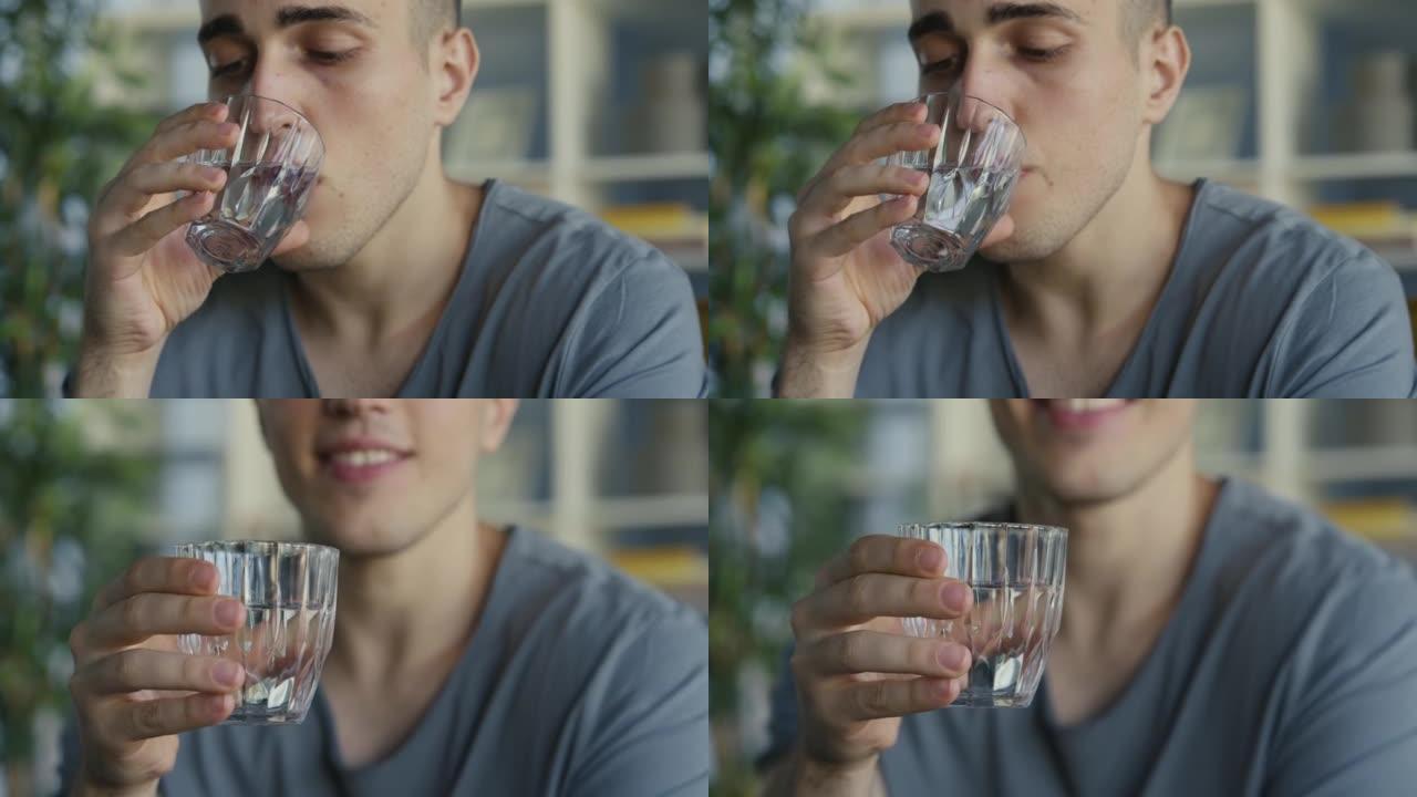 年轻人喝一杯水