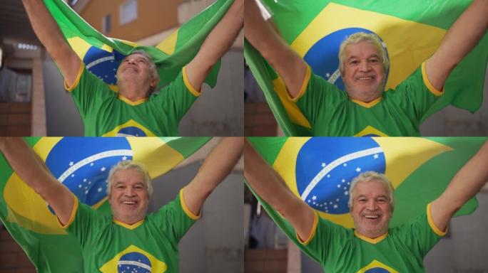 在家中用巴西国旗庆祝的高级男子肖像