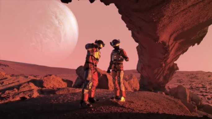 火星红色星球上的两名宇航员。指向天空中的行星木星