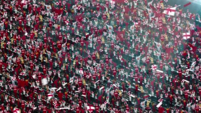 体育场看台上穿着英格兰国旗颜色的人群。激动的足球迷挥舞着旗帜