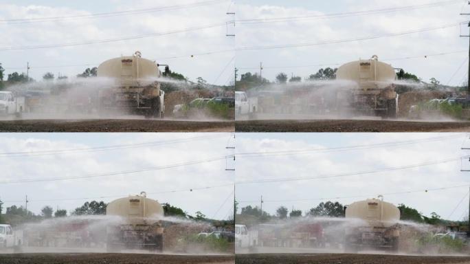 水箱车在建筑工地喷水降尘的慢动作镜头