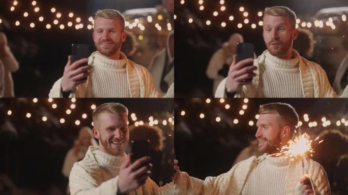 博客作者从圣诞晚会上流出，微笑着对着智能手机的正面摄像头，快乐的男人肖像