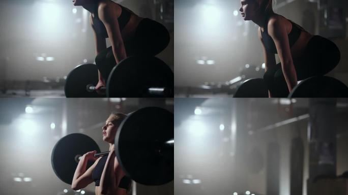 金发碧眼的运动女人在健身房努力工作，举起杠铃，在训练健身馆慢动作