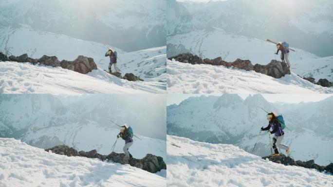 女登山者滑雪游览雪岭