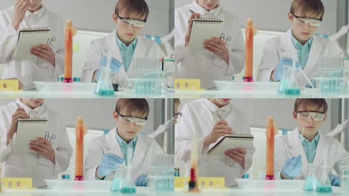 孩子们进行科学实验。实验室内部，混合泡沫，搅动液体