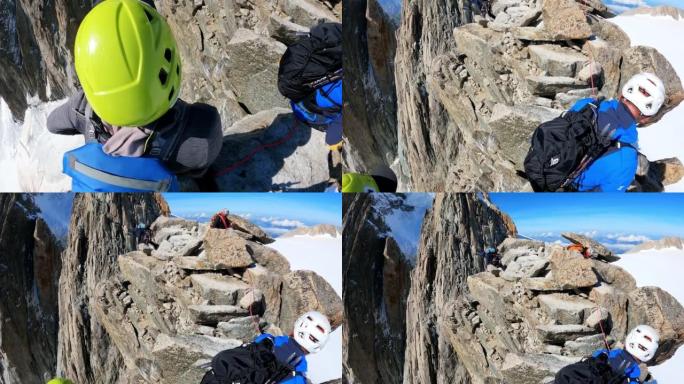 专业登山者在尖峰上移动。用绳子。欧洲阿尔卑斯山的鸟瞰图