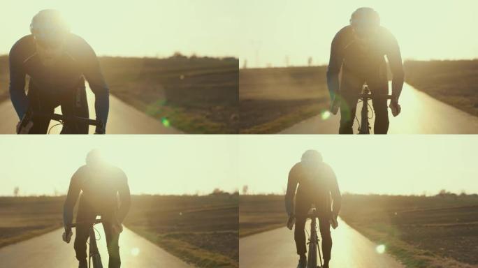乡村景观培训。男性公路自行车手飞向摄像机。