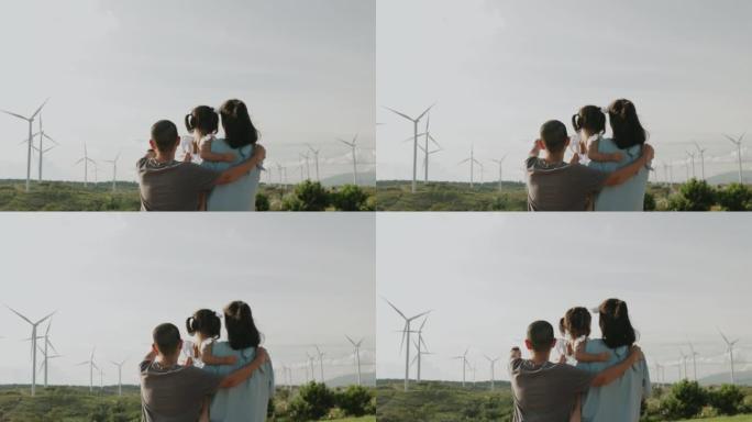假日旅行到大型风力涡轮机与替代能源领域与家人。
