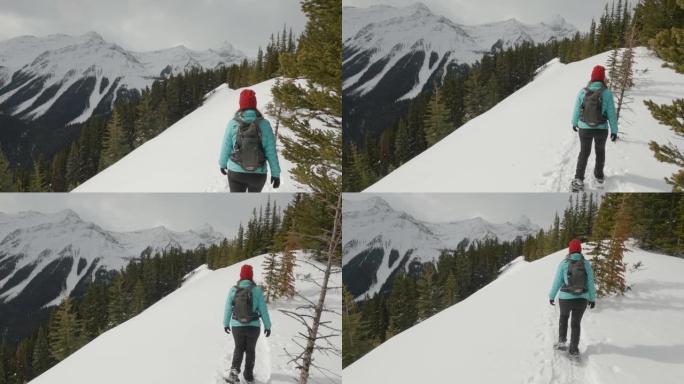 在山脊上，女人雪鞋行走的第一人称视角