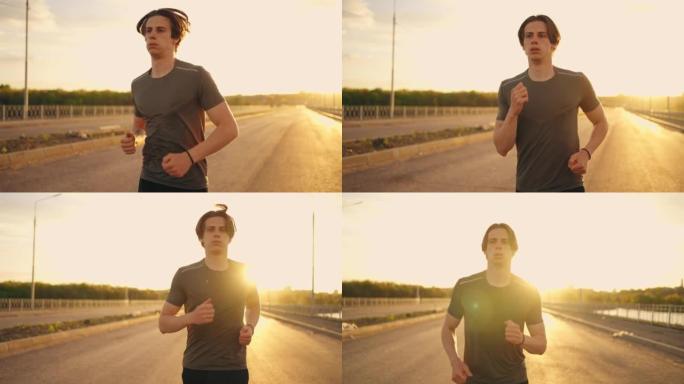中号跑男肖像在阳光明媚的早晨，运动员在空旷的路上慢跑，独自训练