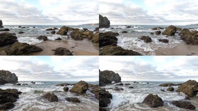 海浪冲撞海滩，岩石的风景