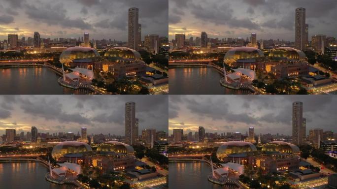 暮光之城夜间照明新加坡市中心现代剧院空中全景4k
