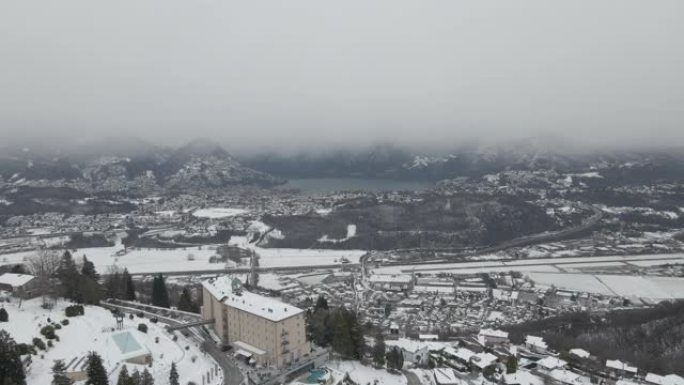 空中无人机拍摄雪山谷城市