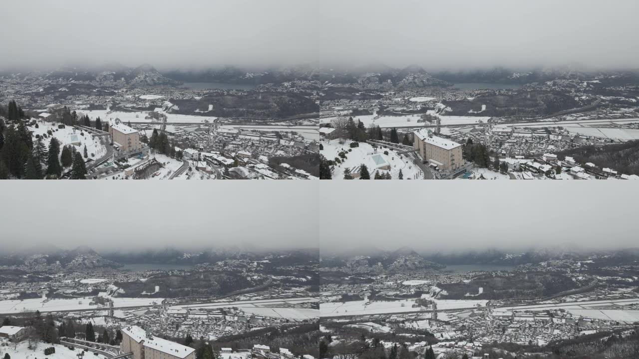 空中无人机拍摄雪山谷城市