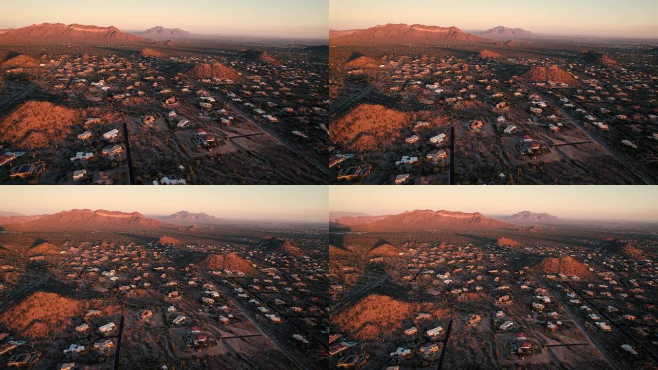 背景为山脉的农村住宅的亚利桑那日落天线