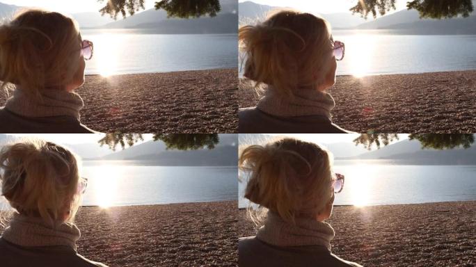 女人拍山湖的智能手机照片