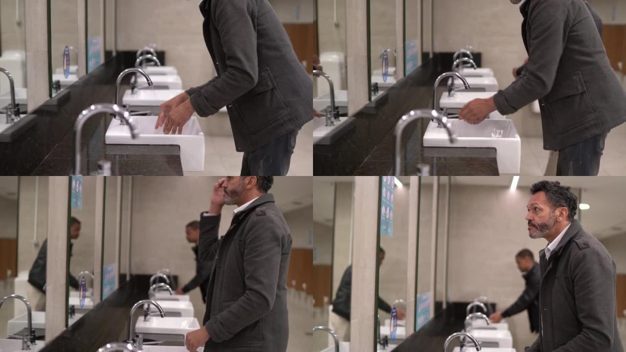 男子在公共浴室洗手