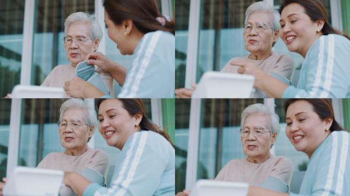 女性在家检查老年患者的血压