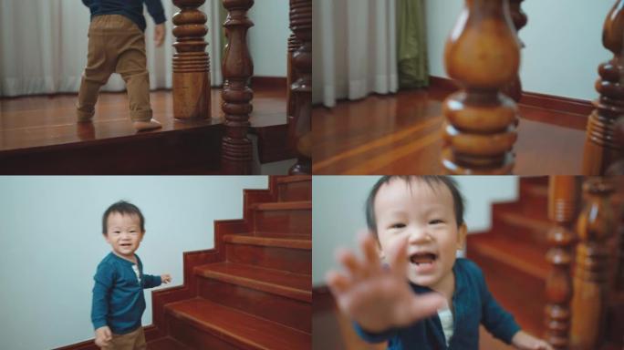 可爱的蹒跚学步的男孩在楼梯上移动