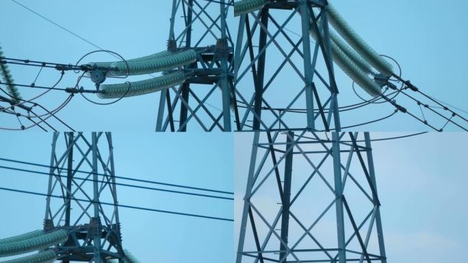 在野外高压电力线桅杆在蓝天下大量
