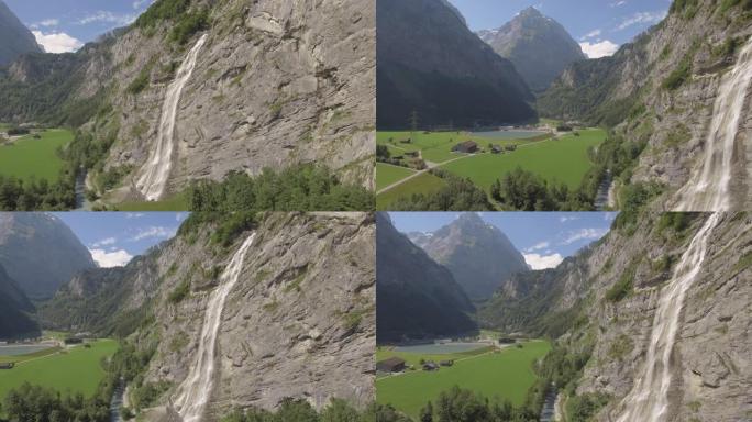 空中无人机拍摄了郁郁葱葱的山谷和瀑布前景