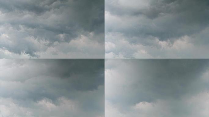 4k延时镜头雨云在下雨前在天空中移动，乌云像画一样滚动穿过天空。