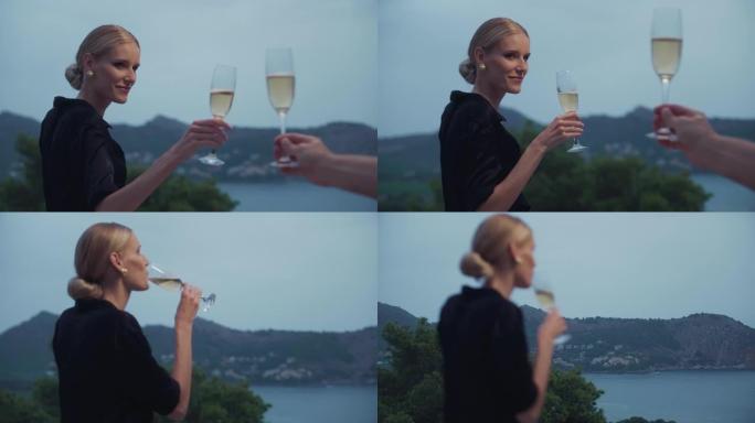 女人在新年派对上与朋友敬酒。喝香槟庆祝节日