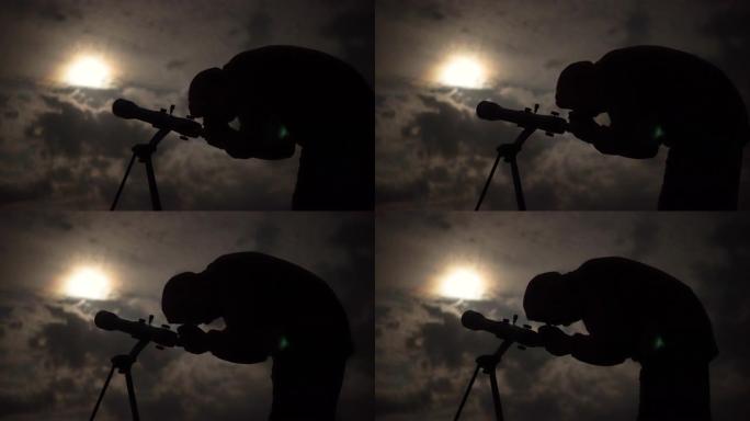 人类通过望远镜望向月球下的夜空