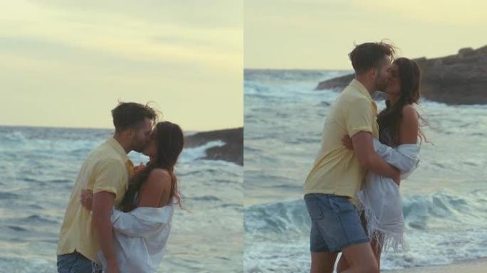 海滩上的浪漫情侣。相爱的情侣手牵着手，在垂直视频周围旋转