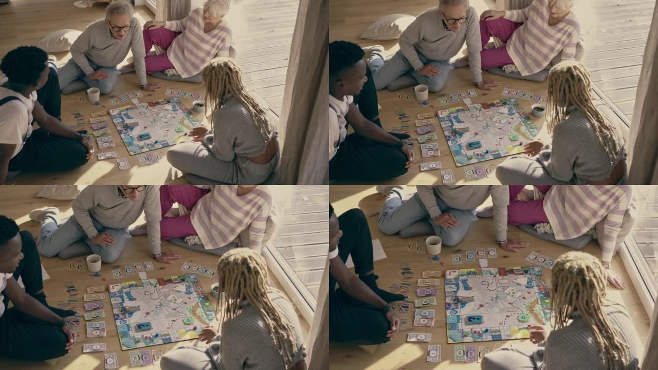 多元化的家庭，非裔美国人的孩子一起在地板上玩棋盘游戏