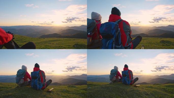 SLO MO CS夫妇在山顶上放松并观看日落