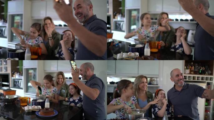 一家人一起做蛋糕，父亲在家拍摄-包括一个有特殊需要的女孩