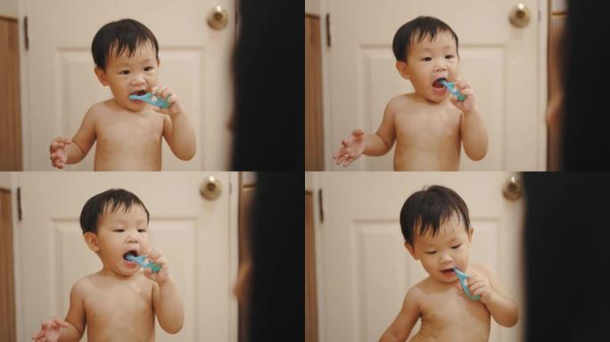 可爱的男孩自学刷牙。