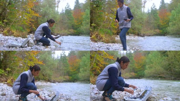 年轻的女生物学生在河里做溶解氧测试