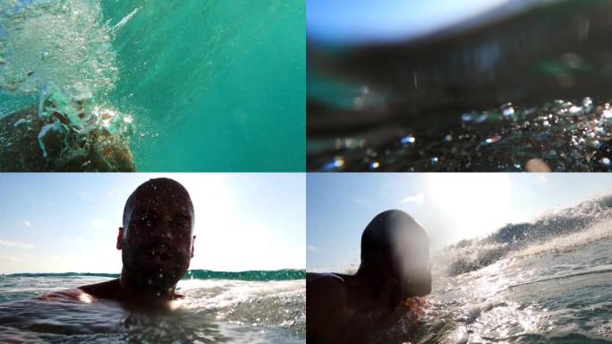 夏天在海里浮潜。男子手持可穿戴相机潜入大海