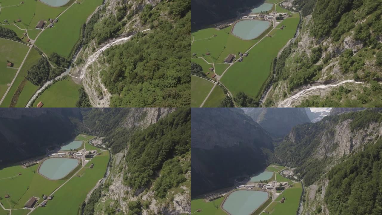 空中无人机拍摄了郁郁葱葱的山谷中的一个水处理地点