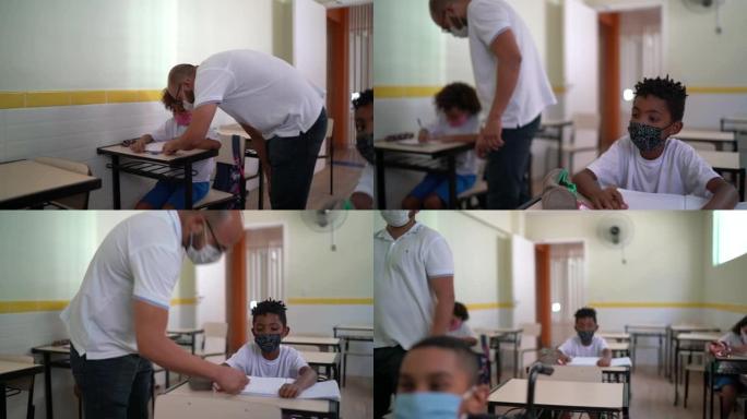 老师在课堂上帮助学生