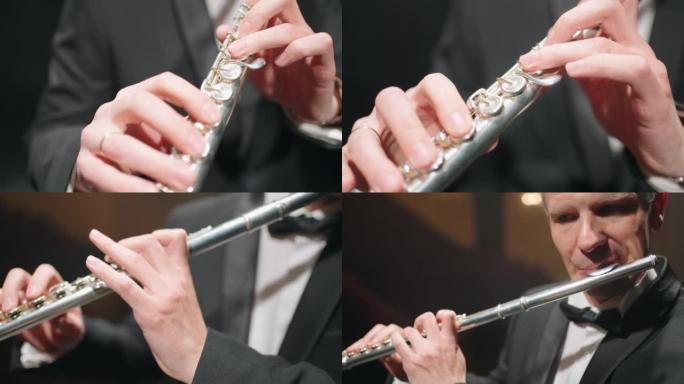 长笛手中的长笛，特写镜头，管弦乐队的音乐家，彩排或音乐会的铜管乐队