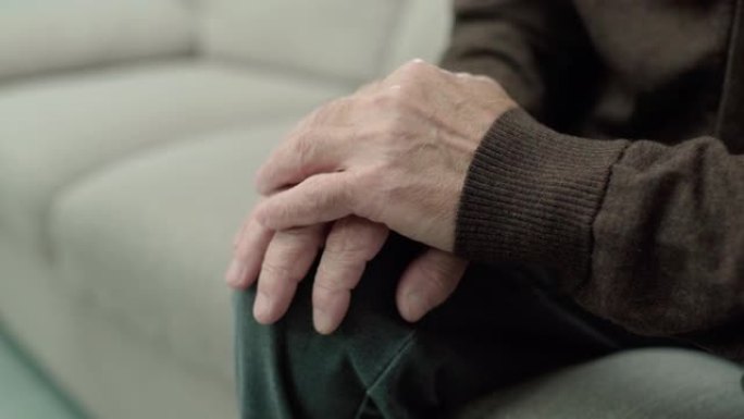 颤抖的男性双手，神经系统疾病，帕金森病，老年护理