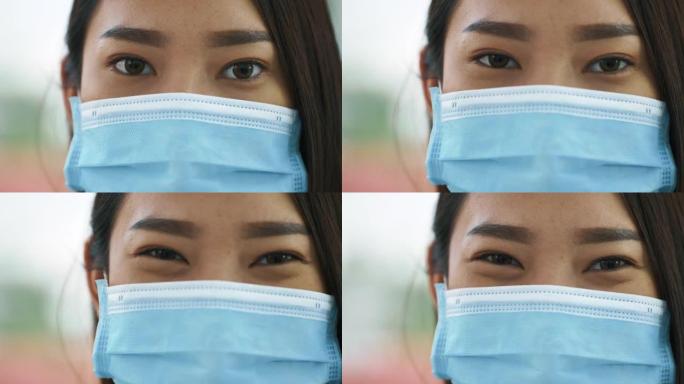 CU: 面具背后微笑的亚洲女性