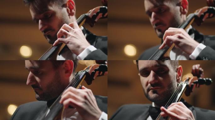 大提琴手在音乐厅演奏大提琴，在老歌剧院排练或小提琴演奏家音乐会