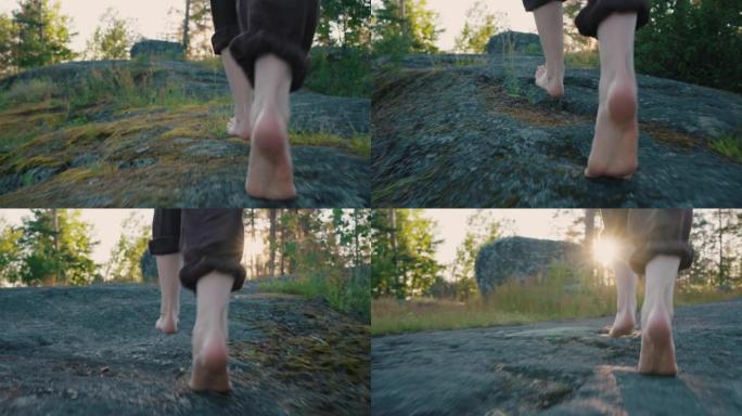 光脚的人在森林的岩石小路上奔跑