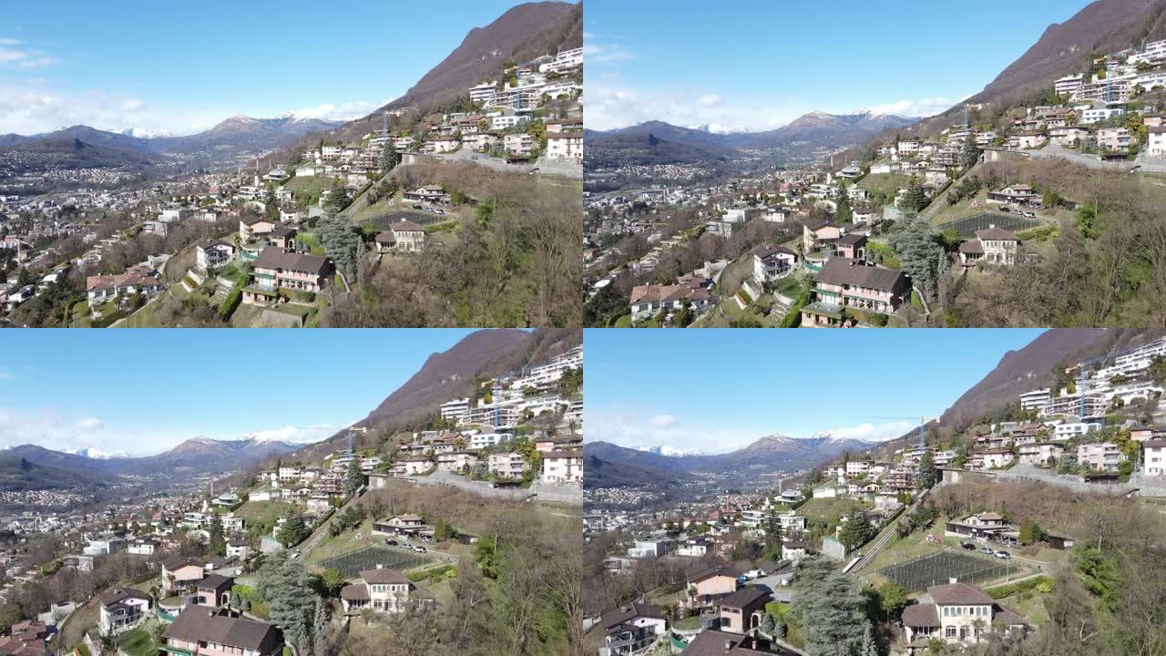 空中无人机在山区人口稠密的山坡上拍摄了缆车