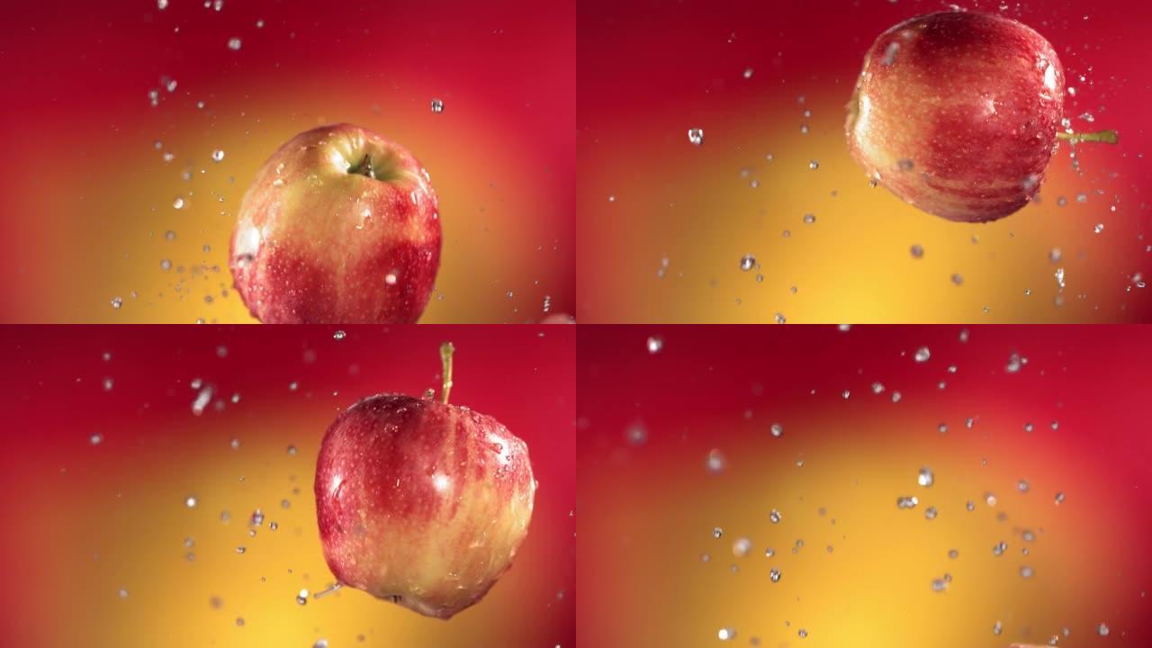 红色黄色背景下的红苹果在慢动作中的飞行