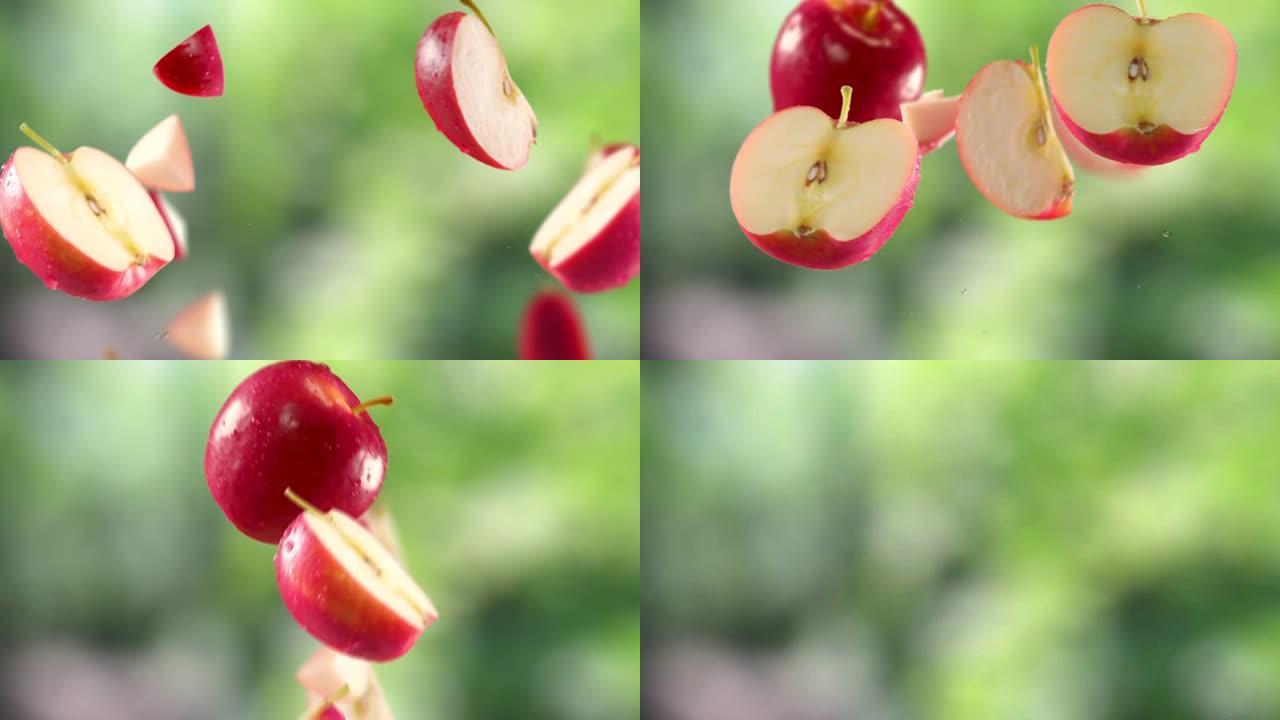 花园背景中的红苹果和切片的飞行