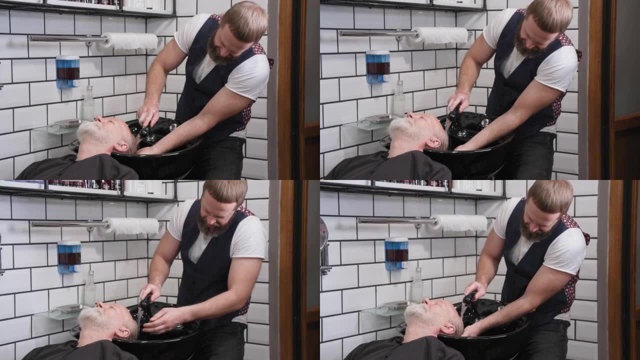 理发店，专业男主造型师在理发店为年长男士理发定型，专业男主造型师在理发店为年长男士理发定型