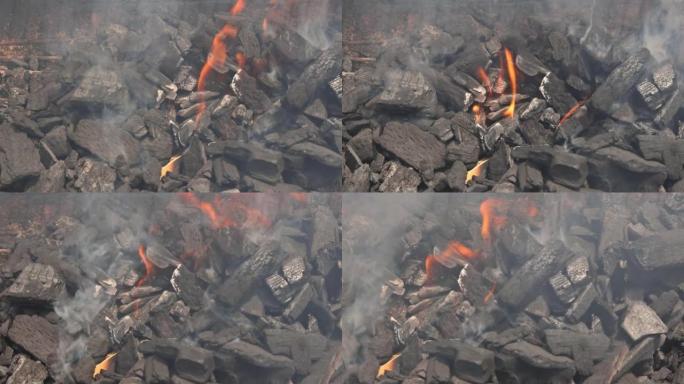烧烤炉上燃烧着火烧的热木炭