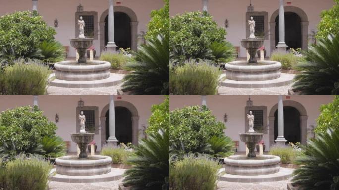 第一人称视角的小喷泉在一个郁郁葱葱的庭院